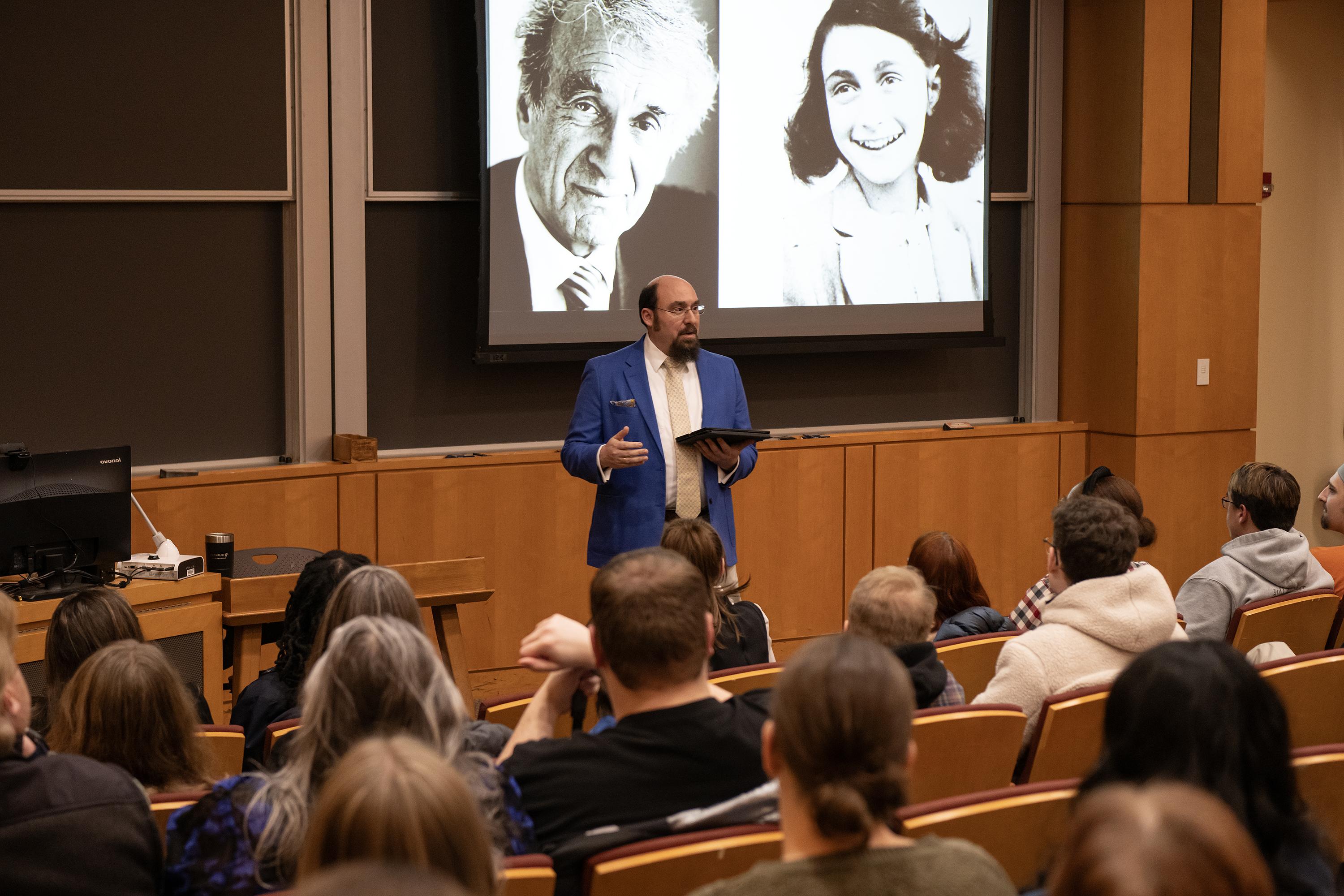 Aaron Krochmal addresses a room of students regarding the Holocaust.